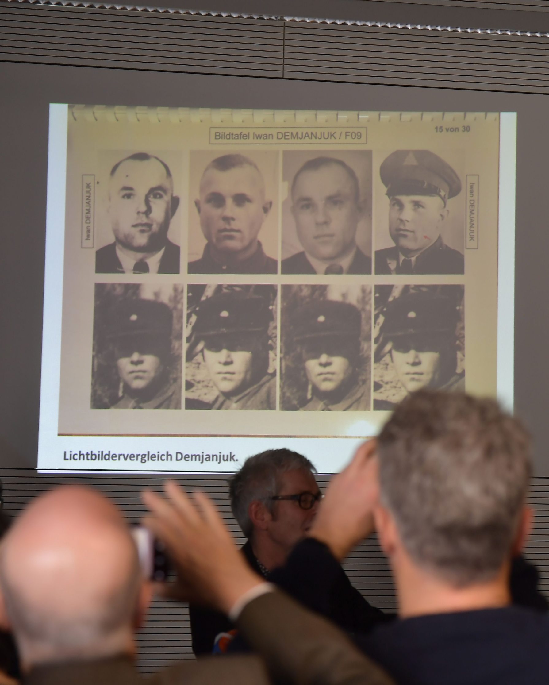 Photographs showing John Demjanjuk are displayed during a press conference on newly discovered photos from Sobibor Nazi death camp on January 28, 2020 in Berlin. - A Berlin museum said on January 20, 2020 that it had unpublished photographs showing former guard John Demjanjuk at the Sobibor extermination camp, where he has denied ever having been. (Photo by Tobias SCHWARZ / AFP)